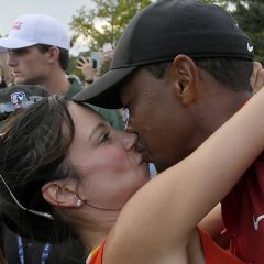 Tiger Woods Seals Victory With a Kiss for Girlfriend